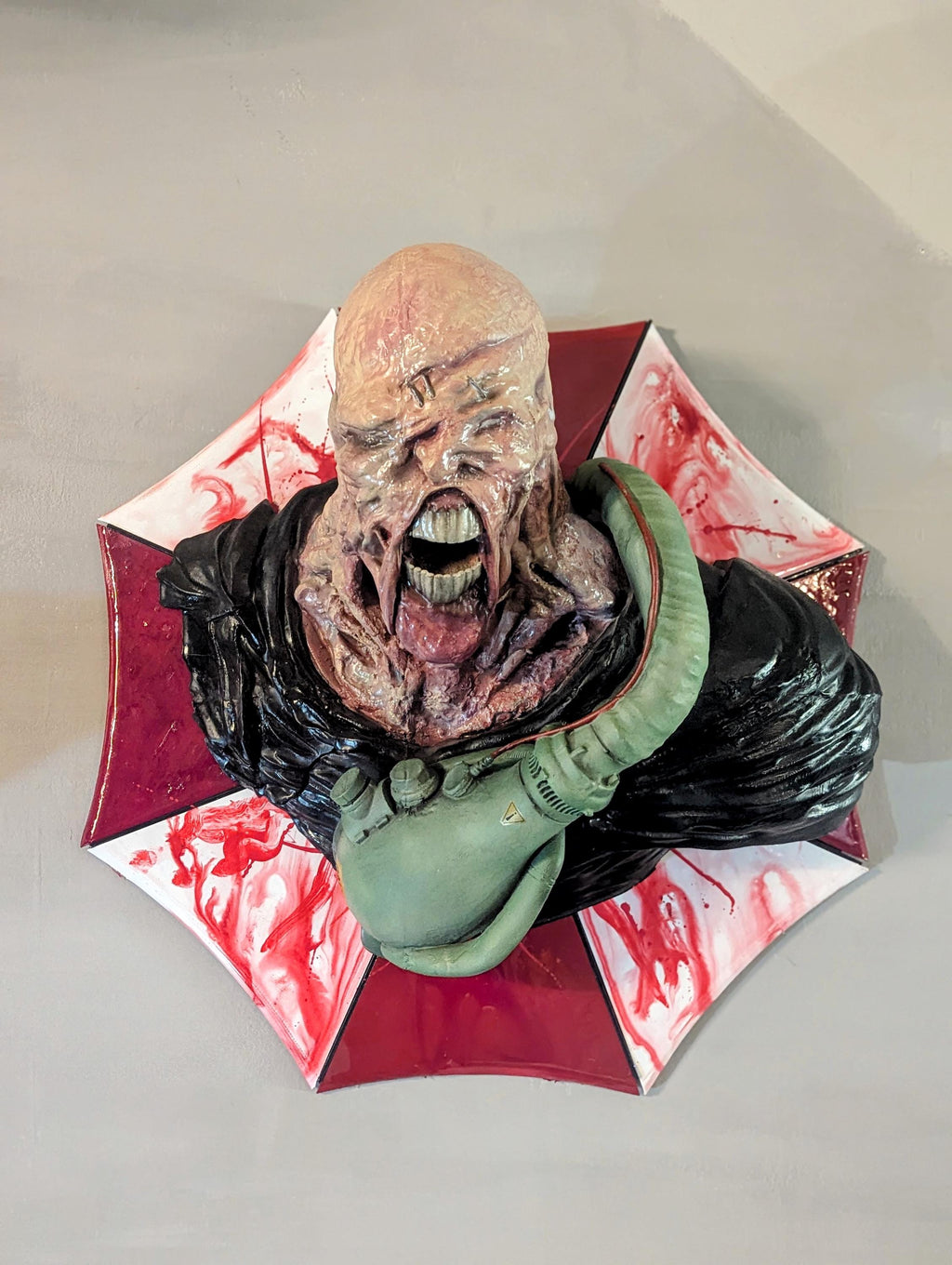 Nemesis – Resident Evil Wall Bust | Handcrafted 3D Horror Sculpture on Umbrella Logo