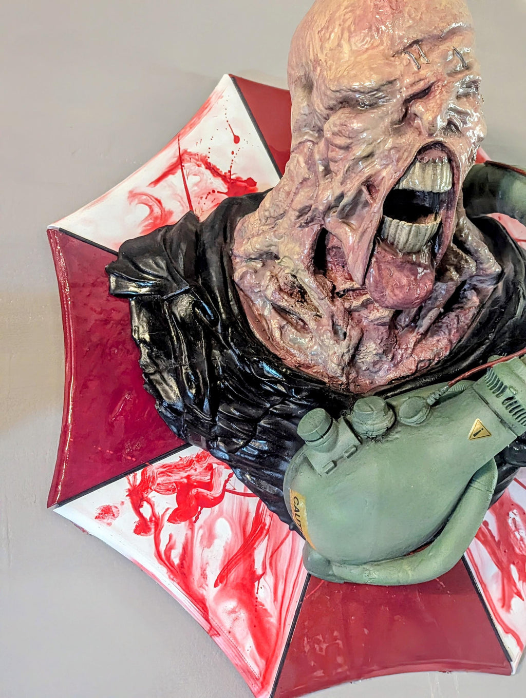 Nemesis – Resident Evil Wall Bust | Handcrafted 3D Horror Sculpture on Umbrella Logo